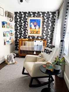 a baby's room decorated in black and white