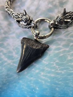 Hand picked Prehistoric Great White Shark Tooth made onto a 22 inch stainless steel wolf head necklace. Tooth size is 1 3/4 inches long. Just a chip missing on right side. Great White Shark Tooth, Great White Shark Teeth, Head Necklace, Shark Tooth Necklace, Tooth Necklace, Viking Style, Shark Tooth, Wolf Head, White Sharks