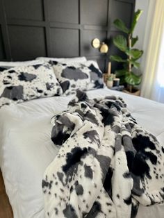 a bed with black and white blankets on it