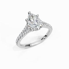 a white gold ring with an oval cut diamond and pave set diamonds on the band