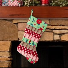 a christmas stocking hanging from a fireplace mantel