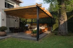 an outdoor living area with furniture and trees