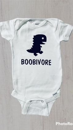 a baby bodysuit with the words boobivore printed on it