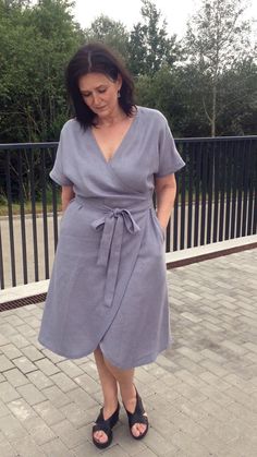 Handmade loose washed wrap linen dress with kimono sleeves, pockets and belt. Comfortable summer swing dress. Made with love for You. *100% local medium weight linen *Each item is individually cut and sewn by order *The model is wearing size XL (customization: bust L, hips XL), dress color - Grey blue *The dress length for XL size from shoulders to hem at the front is 112 cm (44 inch). All customizations is possible by yours individual measurements and wishes - 10 cm is for free). *The model hei Casual Linen Wrap Dress For Beach, Summer Wrap Dress With Kimono Sleeves And Belted Waist, Summer Wrap Dress With Kimono Sleeves And Belt, Casual Linen Wrap Dress With Tie Waist, Spring Wrap Dress With Belted Kimono Sleeves, Beach Wrap Linen Dress, Summer Linen Wrap Dress With Tie Waist, Casual Linen Wrap Dress, Beach Wrap Linen Dress With Tie Waist