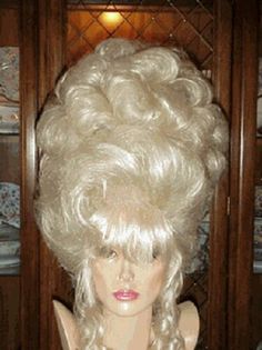 Vegas Girl Wigs   Description Vegas girl Wigs Stylist to the stars for over 35 years. Thanks for looking at our auctions. All of our fine quality wigs arrive to you brand new. Each and every wig we offer is of exceptional quality and styled just for you. THESE WIGS ARE ALL CUSTOM STYLE NEVER 2 EXACTLY ALIKE. SPECIAL COLORS AND AWESOME LOOKS WANT TO LOOK DIFFERENT AND A SHOWSTOPPER, THESE ARE THE WIGS THAT YOU NEED TO GET. awesome, sultry, unbelievable hair styles Every wig we offer is of excepti Big Updo, Girl Wigs, Curled Bangs, Wigs Blonde, Blonde Updo, Drag Wigs, Evening Hairstyles, Bouffant Hair, Quality Wigs