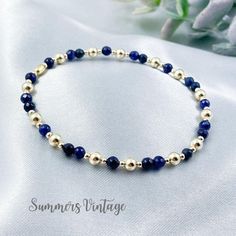 This 14k gold-filled and natural gemstone beaded bracelet embodies the free-spirited essence of boho fashion while adding a touch of elegance to your everyday look The bracelet features deep, dark midnight blue natural sapphire gemstones - Sapphires are believed to be good for attracting abundance, blessings, and gifts. They are also used to protect against negative energies, calm the mind, strengthen intuition, and invite spiritual clarity  The eclectic mix of high-quality natural gemstone and 45th Wedding Anniversary Gifts, Strengthen Intuition, 45th Wedding Anniversary, Sapphire Anniversary, Attracting Abundance, Sapphire Beads, Anniversary Gift For Wife, Bracelet Dainty, Sapphire Wedding