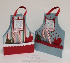 two paper bags with candy canes in them