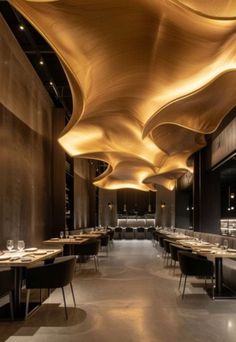 the interior of a restaurant with tables and chairs