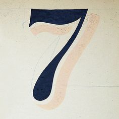 the number seven is painted in blue and pink on a white background with black lines