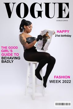 a woman sitting on top of a stool holding a magazine cover with a black figure