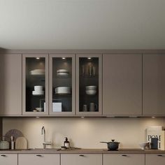 a kitchen that has some cupboards in it