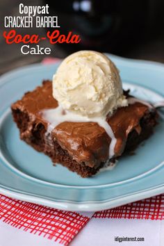 a piece of chocolate cake with ice cream on top is sitting on a blue plate