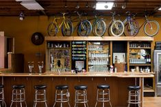 a bar with several bikes mounted to the wall