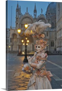 an elaborately decorated statue on the sidewalk in front of a large building with many lights