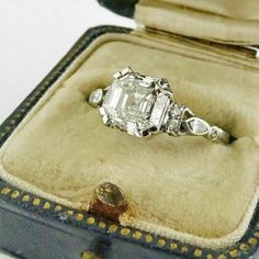 an antique diamond ring in a velvet case