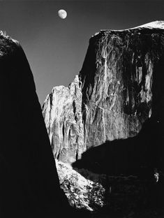 a black and white photo of the moon setting over yose peak in yose national park