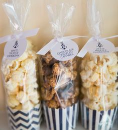 three bags of popcorn sitting on top of a shelf