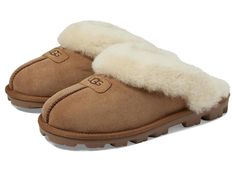 UGG Coquette - Women's Slippers : Chestnut : This shoe runs big and is available in whole sizes only. Order one size down than usual and if between sizes, order 1 1/2 sizes down from your usual size (for example, if you wear a size 9 1/2, order a size 8). The Coquette embraces the essence of a slipper with the radiant style UGG is known for. Signature Twinface upper with a sheepskin cuff for a cute can cozy wear. UGG signature Twinface sheepskin is treated on both sides to provide maximum softness and comfort. Polyester binding. Genuine 17mm sheepskin sockliner wicks moisture away and allows air to circulate, keeping feet dry. Treadlite by UGG outsole delivers traction control. Fit should be snug, but not uncomfortable. Footwear will give a little as fleece footbeds form to each individual