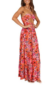 Flirty cutouts at the bodice add to the summery vibes of this strapless maxi dress covered in a vibrant floral print. Hidden side-zip closure Sweetheart neck Strapless Partially lined 100% rayon Hand wash, dry flat Imported Beach Maxi Dress With Cut-out Waist, Fitted Maxi Dress With Cut-out Waist For Beach, Spring Vacation Maxi Dress With Cut-out Waist, Summer Brunch Maxi Dress With Cut-out Waist, Spring Maxi Dress With Spaghetti Straps For Summer Parties, Flirty Spring Dress With Cut-out Waist, Pink Halter Neck Maxi Dress For Beach Season, Summer Maxi Dress With Cut-out Waist, Pink Maxi Dress For Beach Season And Summer Parties