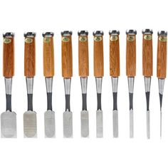 eight different types of wood carving tools lined up in a row on a white background