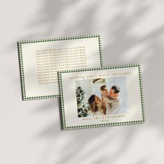 two christmas cards with an image of a couple kissing each other on the front and back