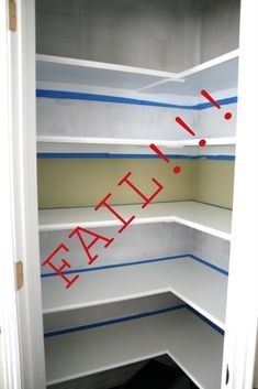 an empty pantry with the word fail painted on it's walls and red arrows pointing in opposite directions