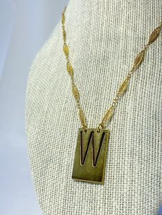 Vintage type set initial letter to personalize your everyday. Each brass letter is unique in its own way and sealed with a clear coat finish to prolong the oxidation process. This 'W' is paired with a vintage up-cycled chain. Vintage Brass Choker Jewelry, Vintage Choker Necklace As Gift, Retro Adjustable Gold Necklace, Adjustable Retro Gold Necklace, Vintage Initial Pendant Jewelry With Charm, Vintage Initial Pendant Charm Jewelry, Vintage Charm Initial Pendant Jewelry, Handmade Vintage Necklace With Rectangular Pendant, Vintage Brass Choker Necklace