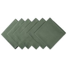 four green napkins sitting on top of each other