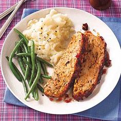 meat, mashed potatoes and green beans on a plate