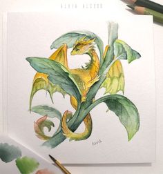 a drawing of a yellow dragon with green leaves