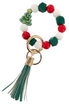 a bracelet with a christmas tree on it and tassels hanging from the clasp