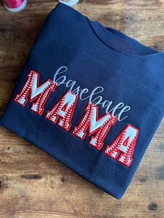 This baseball mama sweatshirt is perfect to wear in the stands to any game!  This is an embroidered custom and personalized baseball sweatshirt  Custom Embroidered Baseball mama sweatshirt - Personalized Baseball Mom on Gildan Collegiate Embroidered Top For Game Day, Team Spirit Sweatshirt With Custom Embroidery For Game Day, Team Spirit Tops With Letter Embroidery For Game Day, Game Day Tops With Letter Embroidery, Cotton Sweatshirt For Baseball Season Fan Gear, School Spirit Cotton Sweatshirt For Baseball Season, Collegiate Cotton Sweatshirt For Baseball Season, Navy Tops With Letter Print For Baseball Season, Navy Letter Print Tops For Baseball Season