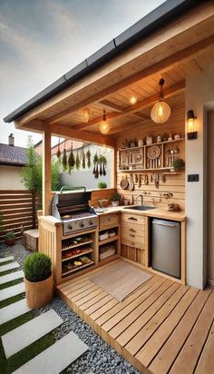 an outdoor kitchen with wood flooring and lighting on the ceiling is next to a wooden deck