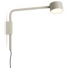 a white wall light with a black cord attached to the arm and an electric plugged in