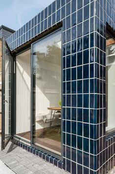 a black and white building with glass windows