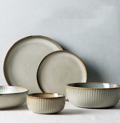 Our range of Japanese-style, curved plates and bowls make mealtimes a more beautiful moment. In a selection of sizes and styles, these ceramic pieces have a textured design and glazed finish. Rice Salad Bowl, Nordic Tableware, Japanese Plates, Cerámica Ideas, Tableware Collection, Rice Bowl, Japanese Ceramics