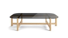 the table is made out of wood and has a black glass tabletop on top