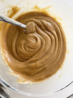 a mixing bowl filled with peanut butter