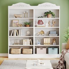 a living room filled with lots of white bookshelves next to a green wall