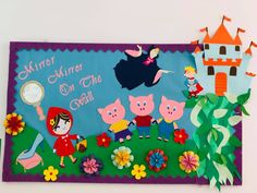 an image of children's artwork on the wall with flowers and animals around it