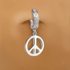 Solid silver belly ring with a cute silver peace sign dangle charm. The belly ring features seven stunning clear CZs that are pave set into the clasp. Fixed to the bottom of the belly ring is a sterling silver peace sign charm.We take our time making our naval rings so it can come out perfect for you our costumers .We want you to feel special when you wear one of the belly rings. when we make our body jewelry we make them with love and the best material we can so they can last longer and be some Silver Dangle Belly Rings Nickel Free, Nickel-free Silver Dangle Belly Rings, Silver Hypoallergenic Dangle Belly Rings, Hypoallergenic Silver Dangle Belly Rings, Nickel-free Dangle Belly Rings In Sterling Silver, Nickel Free Sterling Silver Dangle Belly Rings, Nickel-free Sterling Silver Dangle Belly Rings, Symbolic Silver Jewelry With Peace Sign, Cute Belly Rings