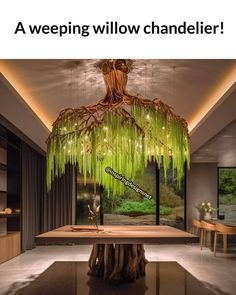 a green chandelier hanging from the ceiling above a table in a living room