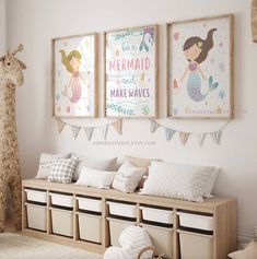 a white room with pink butterfly paintings on the wall and storage bins underneath it