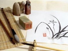 an ink brush and some other items on a table