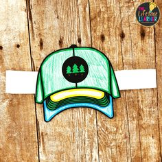 a drawing of a green hat with trees on the front and white band around it