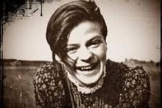 a black and white photo of a woman laughing