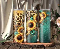 three sunflowers and leopard print tumblers on a wooden table