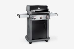 a black grill with two burners and one side door open on a white background