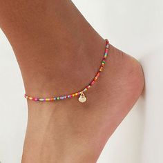 We give you our first anklet collection for this season. Our best selling choker now is an anklet! Beautiful and fun Sterling Silver anklets! This anklet is made with red, black, yellow, orange, teal, and gold seed beads. It is finished with a lobster claw clasp. These waterproof Anklets are a perfect addition to your jewelry collection, beach weddings, bachelorette parties, girl's weekends, and to charm your boyfriend 😉 To find your size, measure your anklet with a string then lay on a ruler to determine your size. The most comfortable fit is just below the ankle bone although many women like the higher look as well! We use only the highest quality materials, Italian sterling silver or Italian Sterling Silver with a heavy 18K gold layer. Length of anklet: 12 inches Extender : up to 3 inc Pulseras Kandi, Leg Jewelry, Anklets For Women, Beaded Ankle Bracelets, Metaphysical Jewelry, Barefoot Sandal, Gelang Manik-manik, Beaded Ankle, Heart Anklet