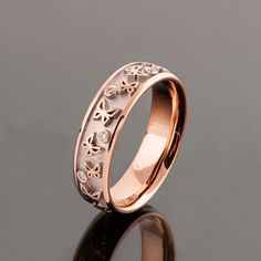 A handmade, solid 18k rose gold wedding band made with a playful butterflies pattern with a white background that emphasizes the composition. Several, natural small diamonds are scattered along the ring to add some sparkle to it. The interior of the ring is made in a pleasant comfort fit style. Wedding rings are hard to choose, by now I am sure you have seen dozens of rings and maybe you even got the feeling you have seen the same ring with different designers. If you are looking at my wedding r Butterflies Pattern, Rose Gold Wedding Band, Rose Gold Wedding Bands, Wooden Gift Boxes, Ring Collection, Rose Gold Wedding, Recycled Gold, Butterfly Pattern, Gold Wedding Band